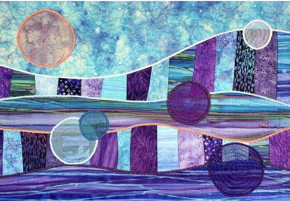 purple and aqua shades of blue, quilt incorporated curves and circles