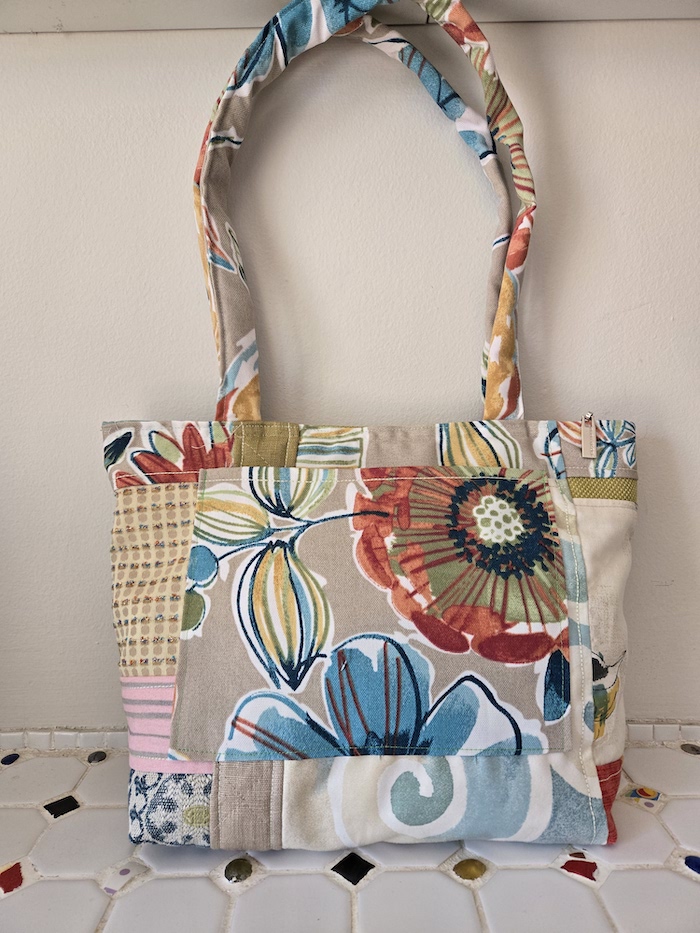Handbag made with a variety of scraps taupe, blue and rust