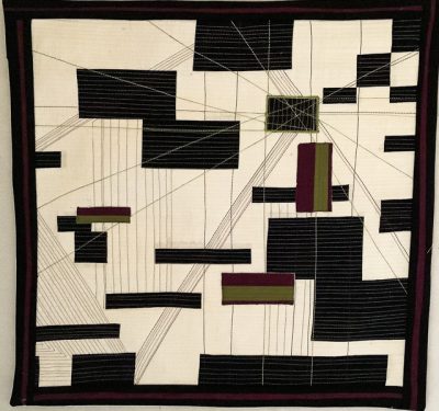 modern style quilts with black rectangles and perspective lines